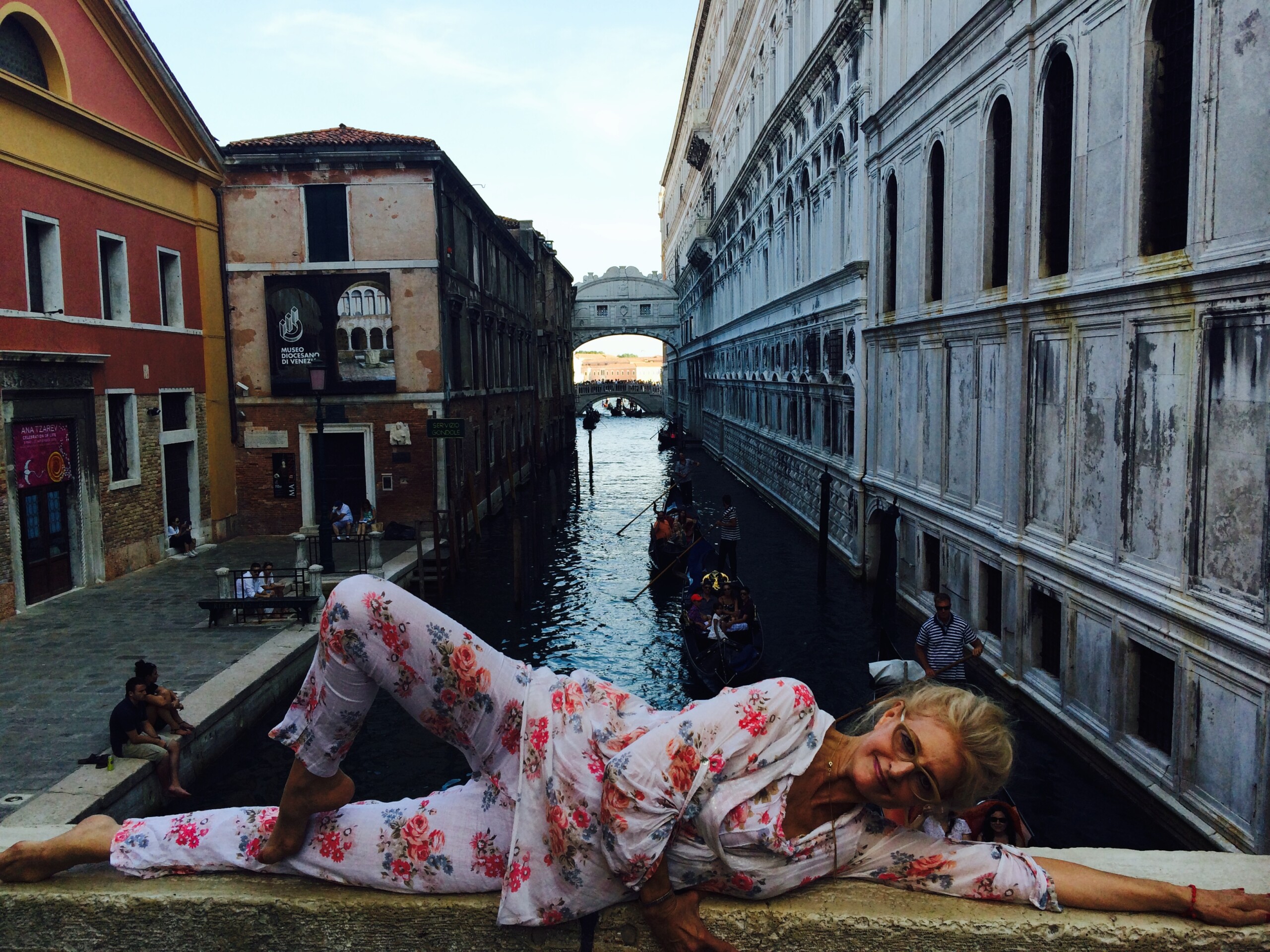 Camille Rommett on Venice Bridge Overlooking Waterbody