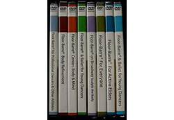 A series of dvds are stacked on top of each other.