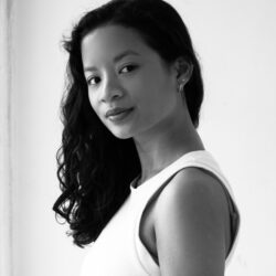 Woman in white top, black and white portrait.