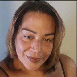 Portrait of a woman with shoulder-length hair.